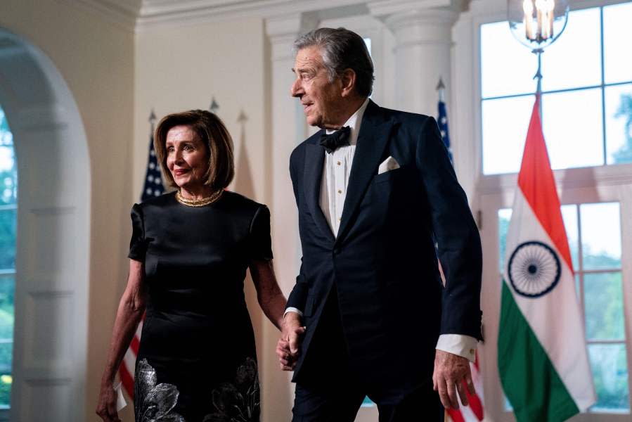 US Representative Nancy Pelosi (D- CA) and Paul Pelosi arrive for an official State Dinner at the White House in Washington, DC. (Photo by STEFANI REYNOLDS/AFP via Getty Images)