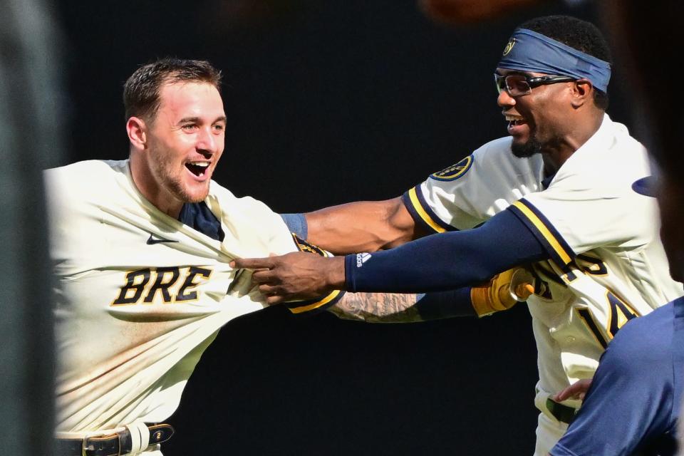 Brewers second baseman Brice Turang, left, celebrates with third baseman Andruw Monasterio after Turang drove in the winning run in the 10th inning to beat the Twins at American Family Field.