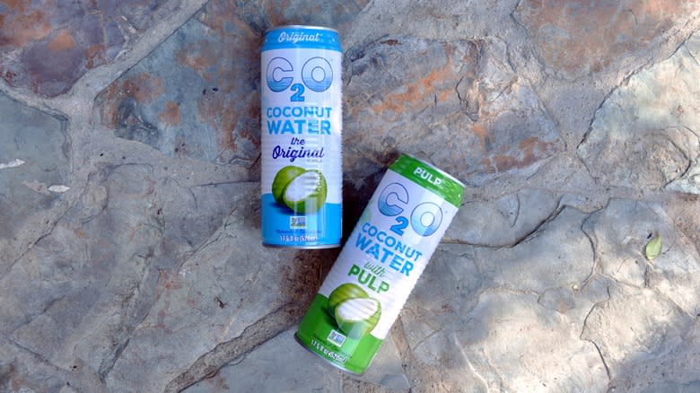 Cans of C2O coconut water