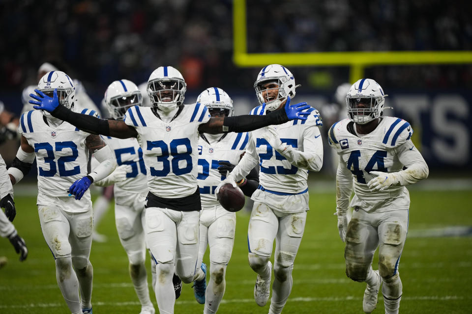 Indianapolis Colts safety Rodney Thomas II (25) celebrates his game-sealing interception with teammates in the second half of an NFL football game against the New England Patriots in Frankfurt, Germany Sunday, Nov. 12, 2023. The Colts won 10-6. (AP Photo/Martin Meissner)