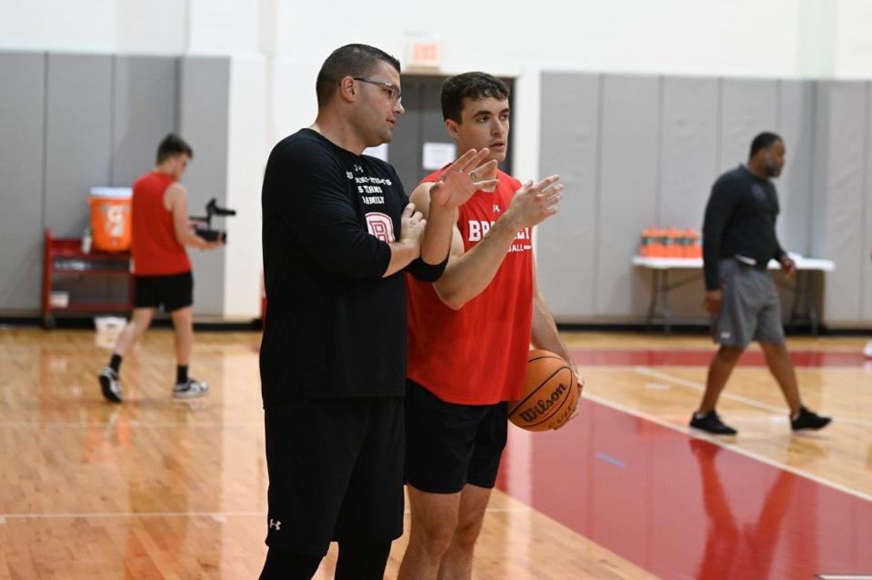 Bradley Braves head coach Brian Wardle talks with starting guard Connor Hickman during a summer workout on the Hilltop.