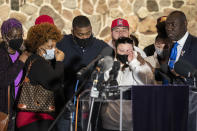Family members of the deceased Daunte Wright, from left, Angie Golson, grandmother, Naisha Wright, aunt, Aubrey Wright, father, Katie Wright, mother, and the family's attorney Ben Crump, right, attend a news conference at New Salem Missionary Baptist Church, Thursday, April 15, 2021, in Minneapolis. (AP Photo/John Minchillo)