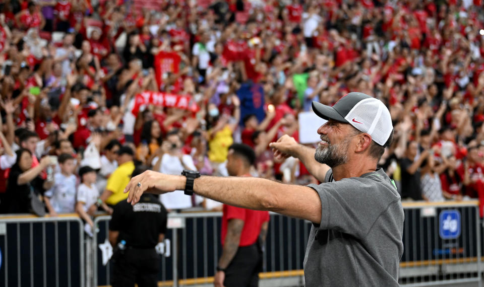 Liverpool manager Jurgen Klopp acknowledges their fans at the end of the Festival of Football friendly against Bayern Munich at the National Stadium in Singapore.