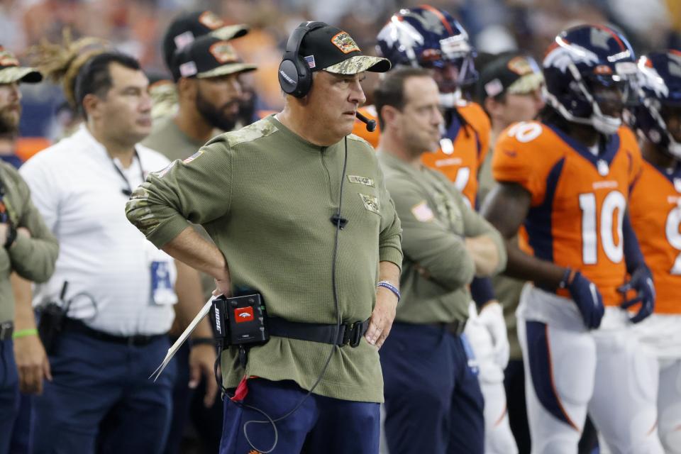 Denver Broncos Head Coach Vic Fangio, center, watches play in the first half of an NFL football game against the Dallas Cowboys in Arlington, Texas, Sunday, Nov. 7, 2021. (AP Photo/Michael Ainsworth)