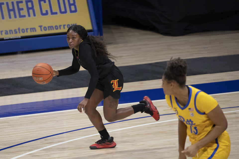 Louisville's Dana Evans (1) moves the ball down the court during the second half of an NCAA college basketball game, Thursday, Feb. 18, 2021, in Pittsburgh. Louisville defeated Pittsburgh 82-58. (AP Photo/Rebecca Droke)