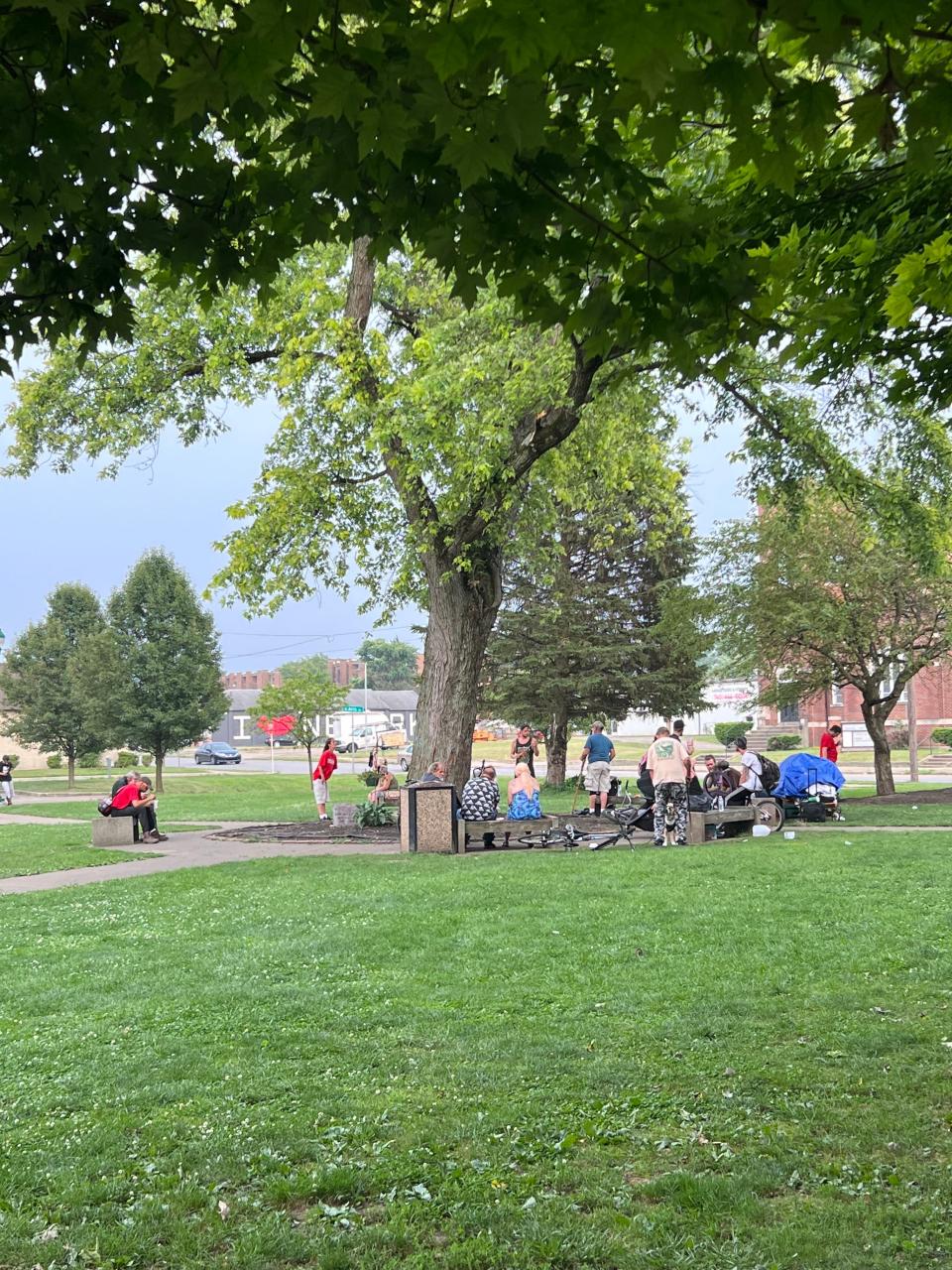 A towering tree in the front lawn of The Salvation Army provides shade for those waiting for meals at the shelter on East Main Street.