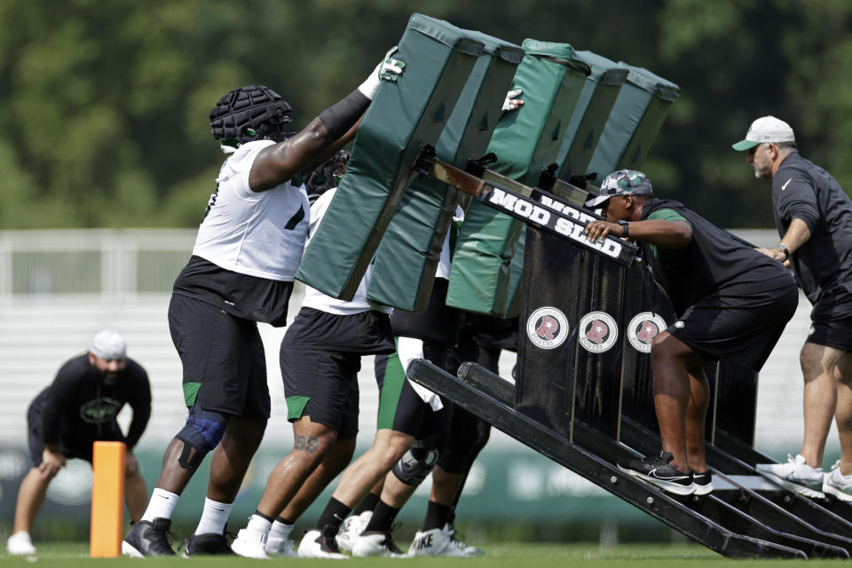 New York Jets guard Mekhi Becton takes part in drills at the NFL football team's training camp in Florham Park, N.J., Thursday, July 28, 2022. (AP Photo/Adam Hunger)