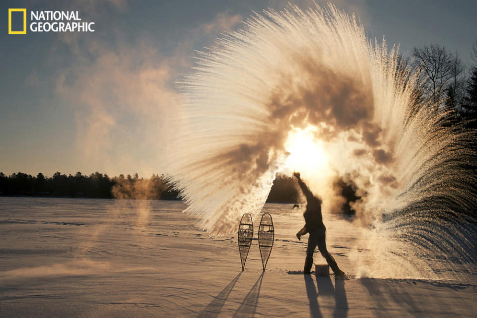 With temperature swings of nearly 60ºF over several days, cold arctic air moves in over Ely, Minnesota. Toss a ladle of hot water into the frigid air and the water vaporizes instantly. A wonderful dance of physics and nature. Photograph taken on South Farm Lake on the edges of the Boundary Waters Canoe Area Wilderness. (Photo and caption Courtesy Layne Kennedy / National Geographic Your Shot) <br> <br> <a href="http://ngm.nationalgeographic.com/your-shot/weekly-wrapper" rel="nofollow noopener" target="_blank" data-ylk="slk:Click here;elm:context_link;itc:0;sec:content-canvas" class="link ">Click here</a> for more photos from National Geographic Your Shot.