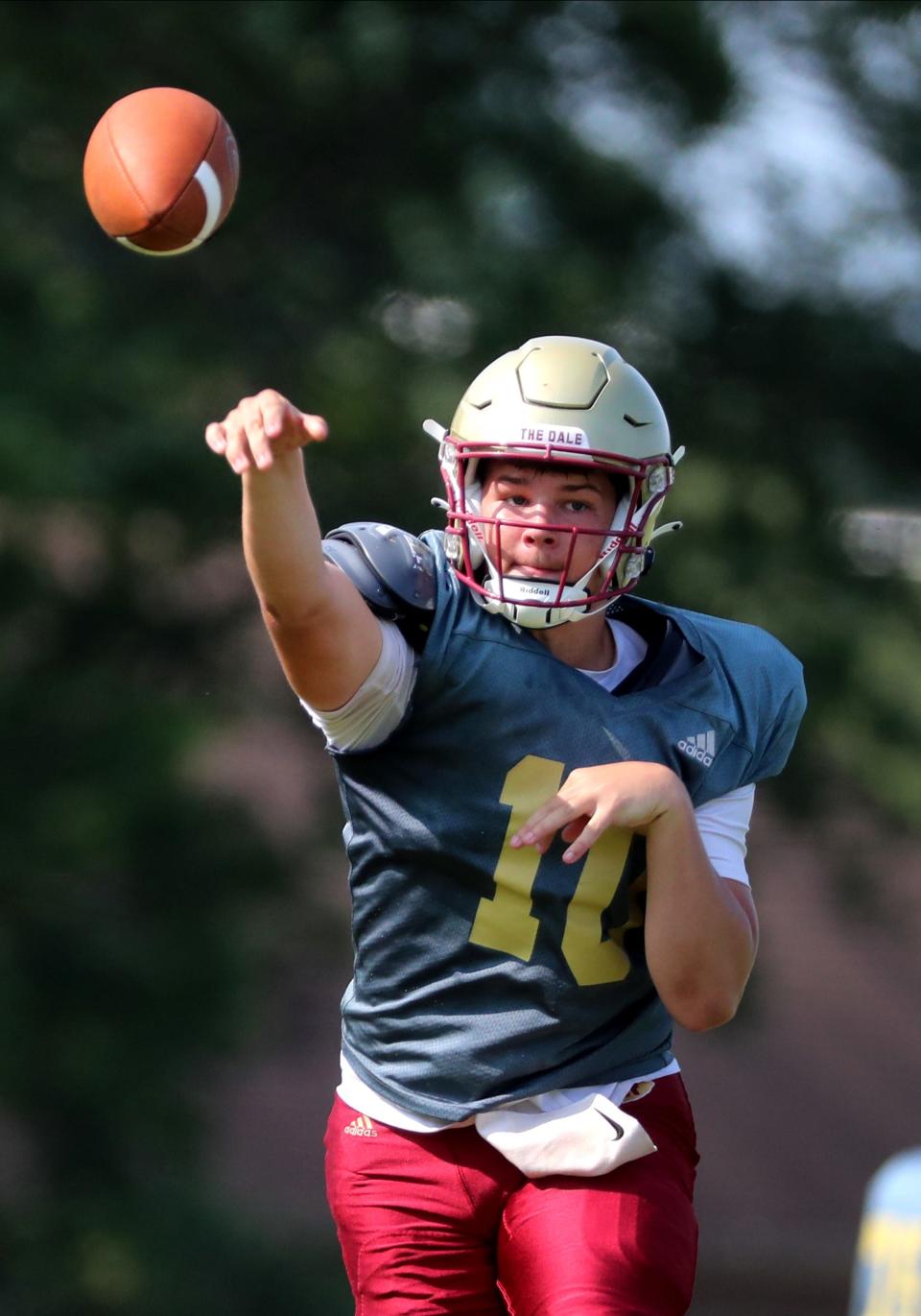 Riverdale's Braden Graham (10) passes the ball during the first football practice in pads for the season on Monday, July 24, 2023.