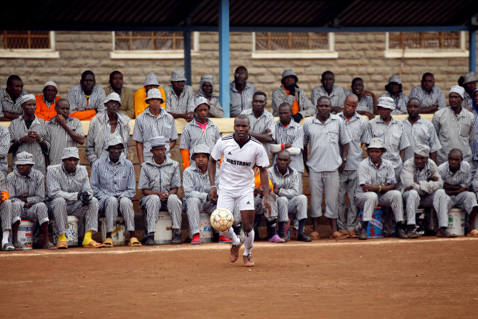 <p>Kenyan prisoners watch a mock World Cup soccer match at the Kamiti Maximum Security Prison, Kenya’s largest prison facility, near Nairobi, on June 14, 2018. (Photo: Baz Ratner/Reuters) </p>