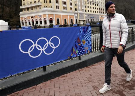 Norway's Aksel Lund Svindal walks through the Rosa Khutor alpine skiing resort during the 2014 Sochi Winter Olympics February 17, 2014. REUTERS/Leonhard Foeger