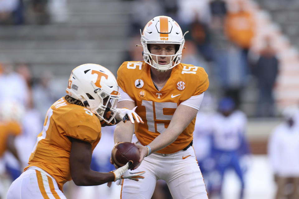 Tennessee quarterback Harrison Bailey (15) hands the ball off to running back Eric Gray (3) during the first half of the team's NCAA college football game against Florida on Saturday, Dec. 5, 2020, in Knoxville, Tenn. (Randy Sartin/Knoxville News Sentinel via AP, Pool)