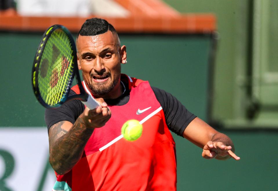 Nick Kyrgios of Australia hits to Rafael Nadal of Spain during the quarterfinals at the BNP Paribas Open at the Indian Wells Tennis Garden in Indian Wells, Calif., Thursday, March 17, 2022.