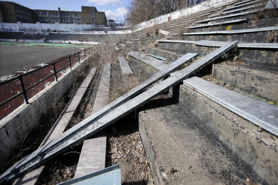 Broken seats are seen in the stands in Hinchliffe Stadium in Paterson, N.J. on Thursday, March 14, 2013. Built as a public works project municipal stadium in 1932, Hinchliffe, listed on the state and National Register of Historic Places, served as home to the New York Black Yankees of the Negro National League from 1933-37 and 1939-45. The once-grand Art Deco stadium earned designation in March as a national landmark - less than two years after the nearby Great Falls, a powerful 77-foot waterfall that helped fuel the Industrial Revolution, became a national park. (AP Photo/Mel Evans)