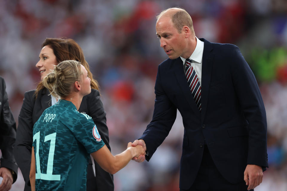Prince William shakes hands with Alexandra Popp of Germany. - Credit: Getty Images