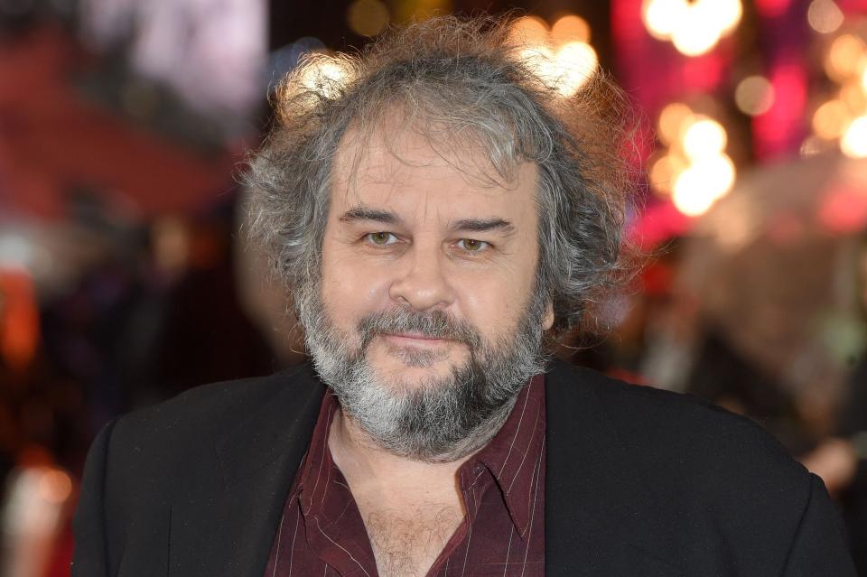 Peter Jackson in a burgundy shirt and black jacket