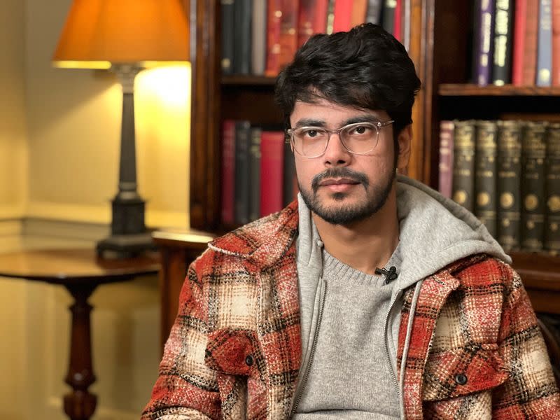 Director Shaunak Sen poses for a photograph during an interview with Reuters in London