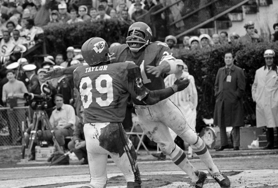 Kansas City Chiefs running back Mike Garrett, right, celebrates with Otis Taylor after scoring a touchdown on a 5-yard run in the second quarter of Super Bowl IV fagainst the Minnesota Vikings, Jan. 11, 1970, at Tulane Stadium in New Orleans. (AP Photo/File)