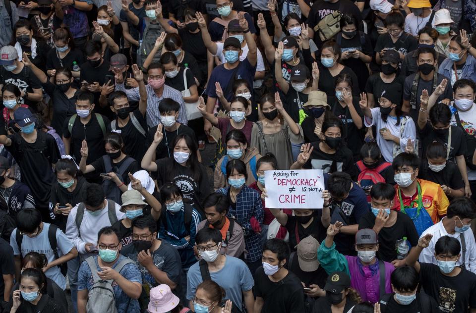 Pro-democracy protesters march during a protest in Udom Suk, suburbs of Bangkok, Thailand, Saturday, Oct. 17, 2020. The authorities in Bangkok shut down mass transit systems and set up roadblocks Saturday as Thailand’s capital faced a fourth straight day of determined anti-government protests. (AP Photo/Gemunu Amarasinghe)