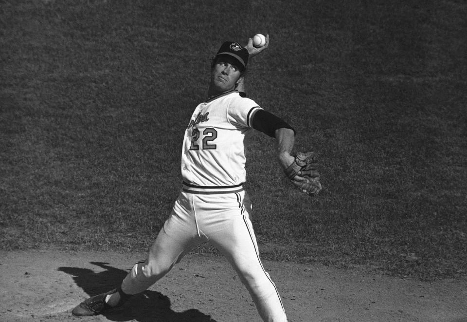 FILE - Baltimore pitcher Jim Palmer (22) delivers during a World Series game, Monday, Oct. 11, 1971, in Baltimore, Md. Palmer pitched 25 complete games in 1975. The entire major leagues have combined for 35 this year, down from 50 last season and 622 in 1988. (AP Photo/File)