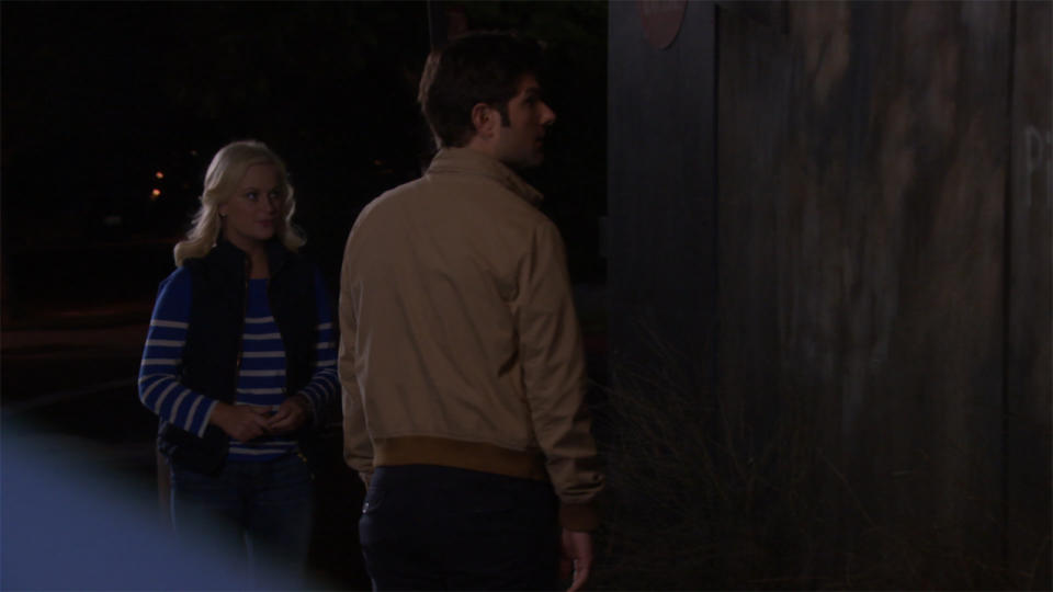 Leslie Knope (Amy Poehler) and Ben Wyatt (Adam Scott) at a gas station  in Parks and Recreation