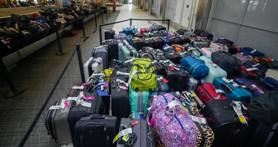 Southwest travelers possessions wait to be claimed following delays and cancellations around the Christmas holiday causing luggage to accumulate Tuesday, Dec. 27, 2022, at Milwaukee Mitchell International Airport.