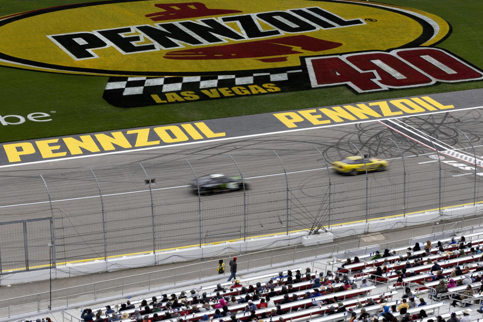 Ty Gibbs (54) and Joey Logano (22) are about to complete a lap during a NASCAR Cup Series auto race on Sunday, March 5, 2023, in Las Vegas. (AP Photo/Ellen Schmidt)