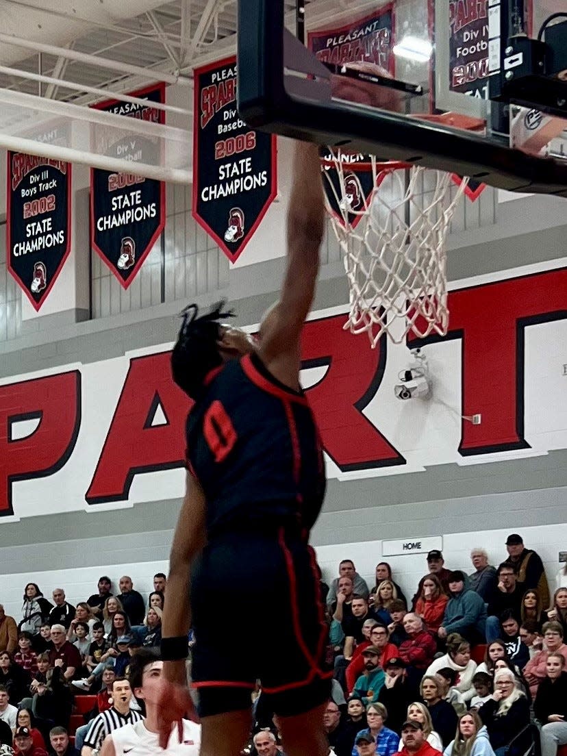 Marion Harding's Marquis Long Jr. breaks away for a dunk at Pleasant Thursday night during a Mid Ohio Athletic Conference boys basketball game.