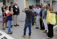 <p>President Donald Trump poses for a photo with residents while visiting Puerto Rico to survey relief efforts following Hurricane Maria in Guaynabo, Puerto Rico, Oct. 3, 2017. (Photo: Jonathan Ernst/Reuters) </p>