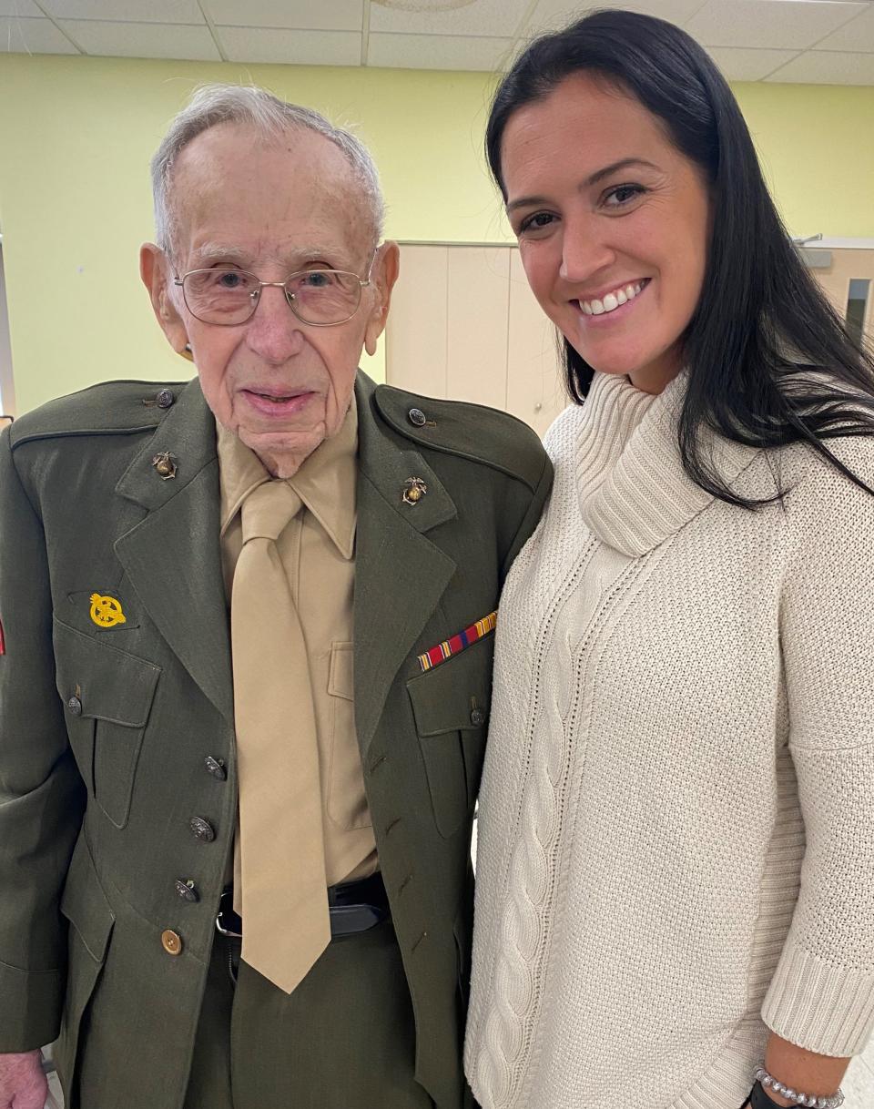 Pat Pastuszak in 2021 at age 100 wears his World War II Marine uniform. He is with state Rep. Alyson Sullivan at a veterans appreciation celebration.