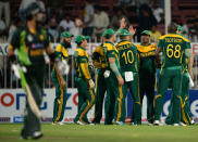 South African cricketers celebrate after taking wicket of Pakistan's opener batsman Ahmad Shehzad (L) during the fifth and final day international at Sharjah Cricket Stadium in Sharjah on November 11, 2013. Pakistan were chasing a challenging 268-run target after South African skipper AB de Villiers samshed a 102-ball 115 not out in his team's 268-7 run total. South Africa lead the five-match series 3-1. AFP PHOTO/ASIF HASSAN