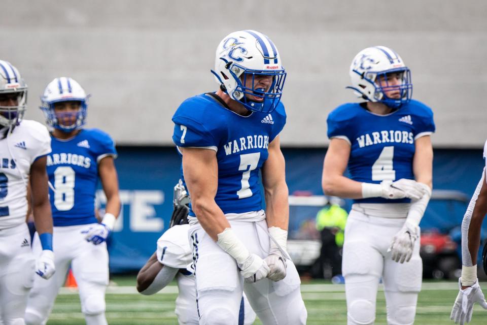Oconee County's West Weeks (7) celebrates after a big play during the first half of the 2020 Class 3A GHSA State Championship football game between the Pierce County Bears and Oconee County Warriors at Center Parc Stadium in Atlanta, Ga. on Wednesday, Dec. 30, 2020.