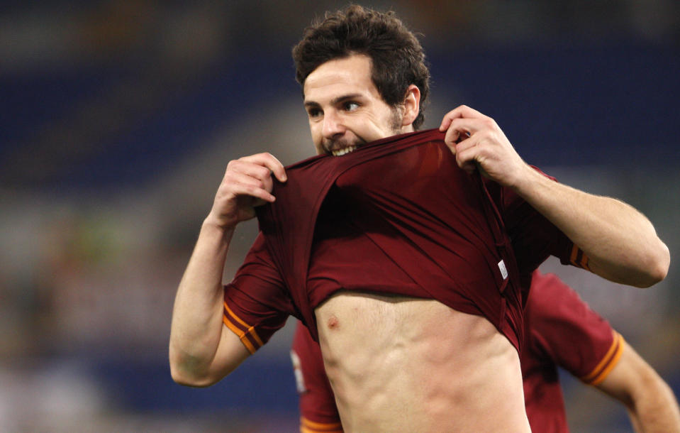 AS Roma forward Mattia Destro celebrates after scoring his second goal during a Serie A soccer match between AS Roma and Sampdoria, at Rome's Olympic stadium, Sunday, Feb. 16, 2014. (AP Photo/Riccardo De Luca)