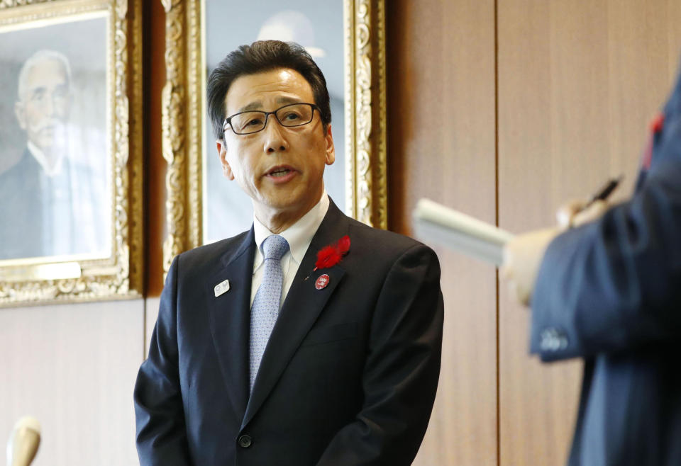 Sapporo Mayor Katsuhiro Akimoto speaks to journalists about a new plan on the 2020 Olympic marathons and race walking events, at the city office in Sapporo, northern Japan Thursday, Oct. 17, 2019. The International Olympic Committee detailed a new plan Wednesday to stage the marathons and race walking events in Sapporo, the host city of the 1972 Winter Olympics, which "will mean significantly lower temperatures for the athletes." (Yohei Fukai/Kyodo News via AP)