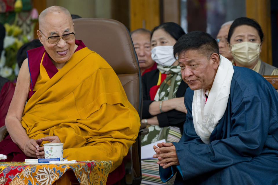 Tibetan spiritual leader the Dalai Lama gestures as he presides over a function marking his 88th birthday at the Tsuglakhang temple in Dharamshala, India, Thursday, July 6, 2023. (AP Photo/Ashwini Bhatia)