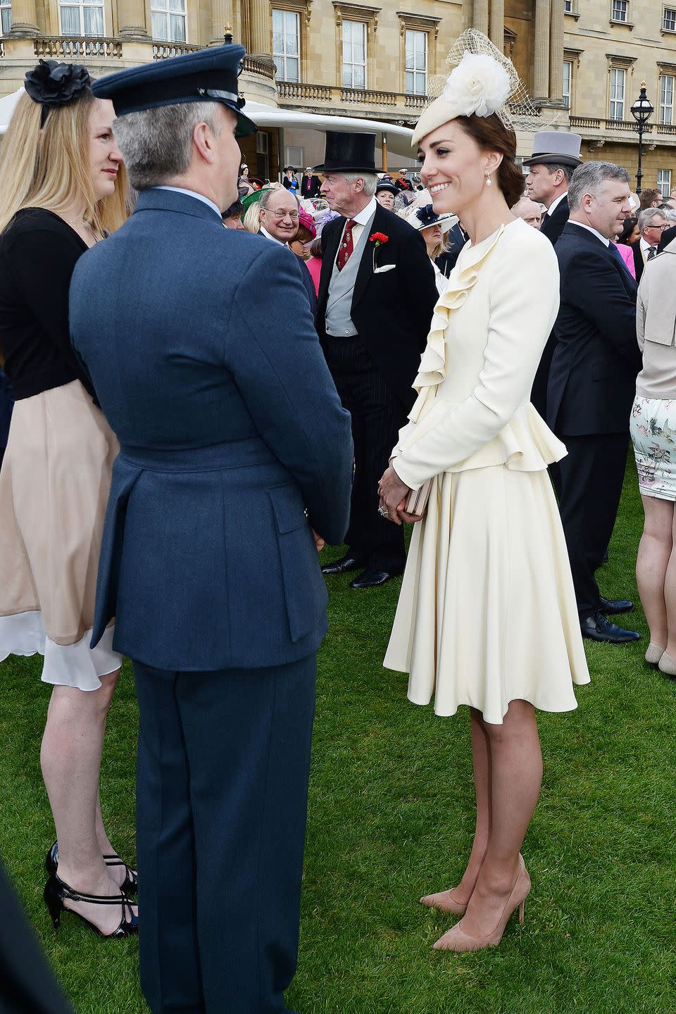 <p>The Duchess dressed in all-white Alexander McQueen at a garden party at Buckingham Palace. It's the <a href="https://www.harpersbazaar.com/celebrity/latest/news/a1130/while-you-were-sleeping-102313/" rel="nofollow noopener" target="_blank" data-ylk="slk:same ensemble;elm:context_link;itc:0;sec:content-canvas" class="link ">same ensemble</a> she wore for Prince George's christening in 2013—cream-colored separates, hat and all.</p>