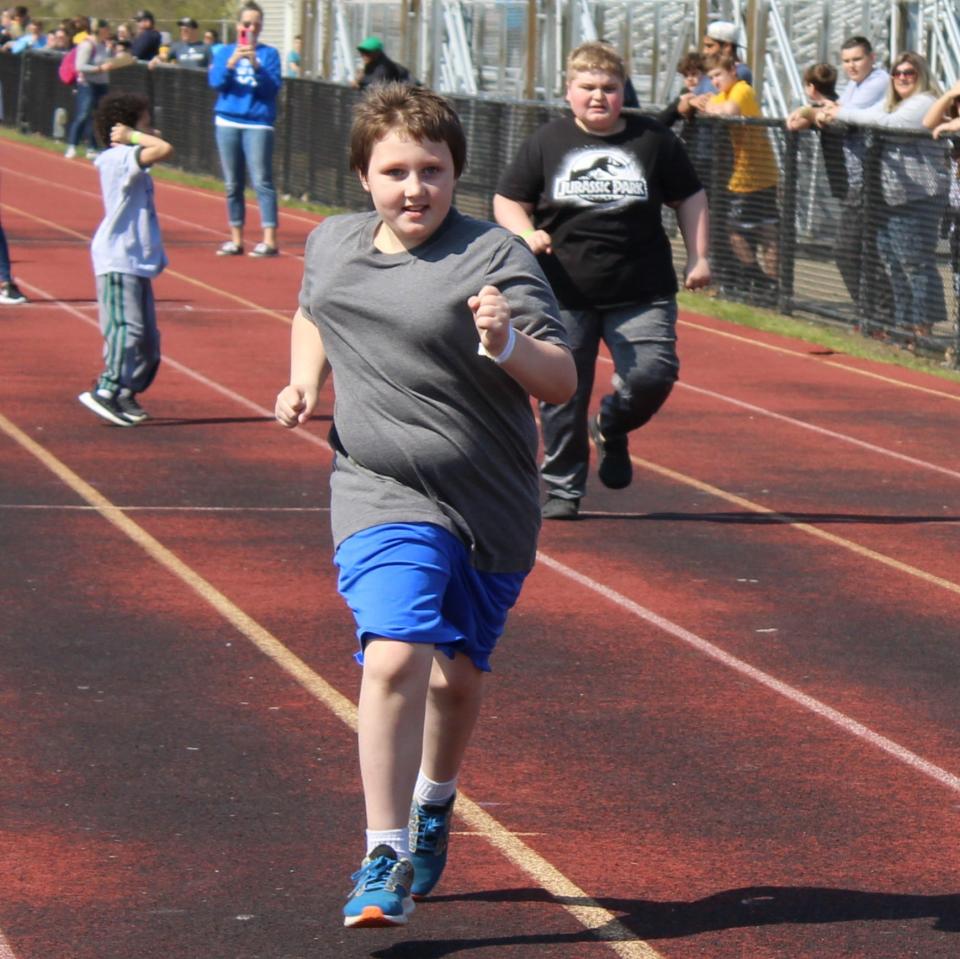 Jacob Adkins, 9, takes the lead in the 50-meter dash at this year's Monroe County Special Olympics hosted at Jefferson High School.