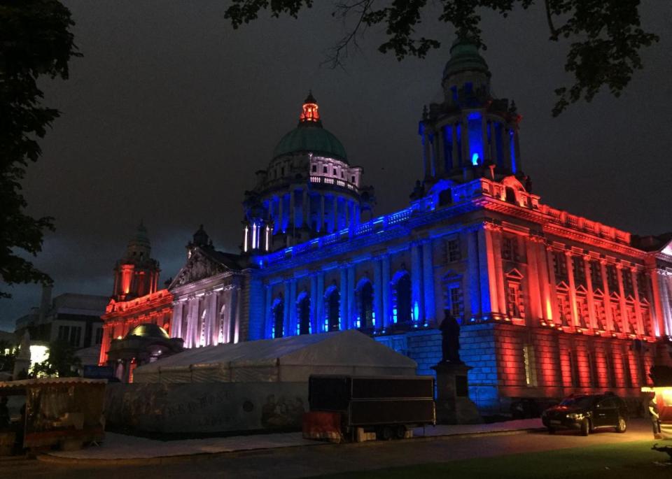 Belfast's City Hall illuminated in the colours of Union flag (PA)