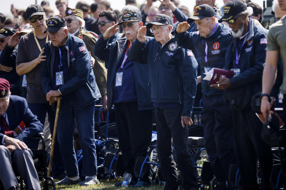 U.S war veterans salute during a ceremony outside the Pegasus Bridge memorial in Benouville, Normandy, Monday June 5, 2023. Dozens of World War II veterans have traveled to Normandy this week to mark the 79th anniversary of D-Day, the decisive but deadly assault that led to the liberation of France and Western Europe from Nazi control. (AP Photo/Thomas Padilla)