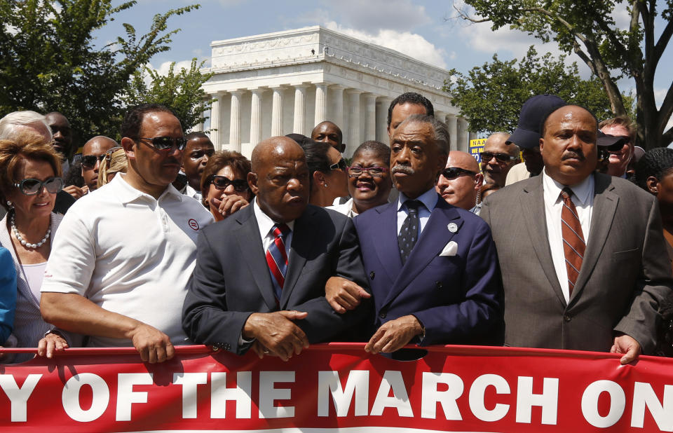 Rev. Al Sharpton (2nd R) links arms with Rep. John Lewis (D-GA) next to Martin Luther King III (R) as they begin to march during the 50th anniversary of the 1963 March on Washington for Jobs and Freedom at the Lincoln Memorial in Washington August 24, 2013. (Photo: Kevin Lamarque/Reuters)