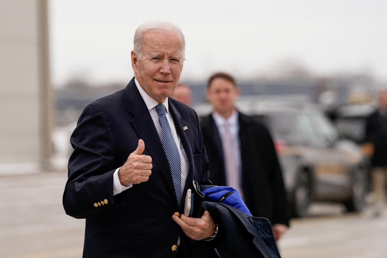 U.S. President Joe Biden gestures to reporters before boarding Air Force One en route to Camp David at Hancock Field Air National Guard Base in Syracuse, New York, U.S., February 4, 2023. REUTERS/Elizabeth Frantz