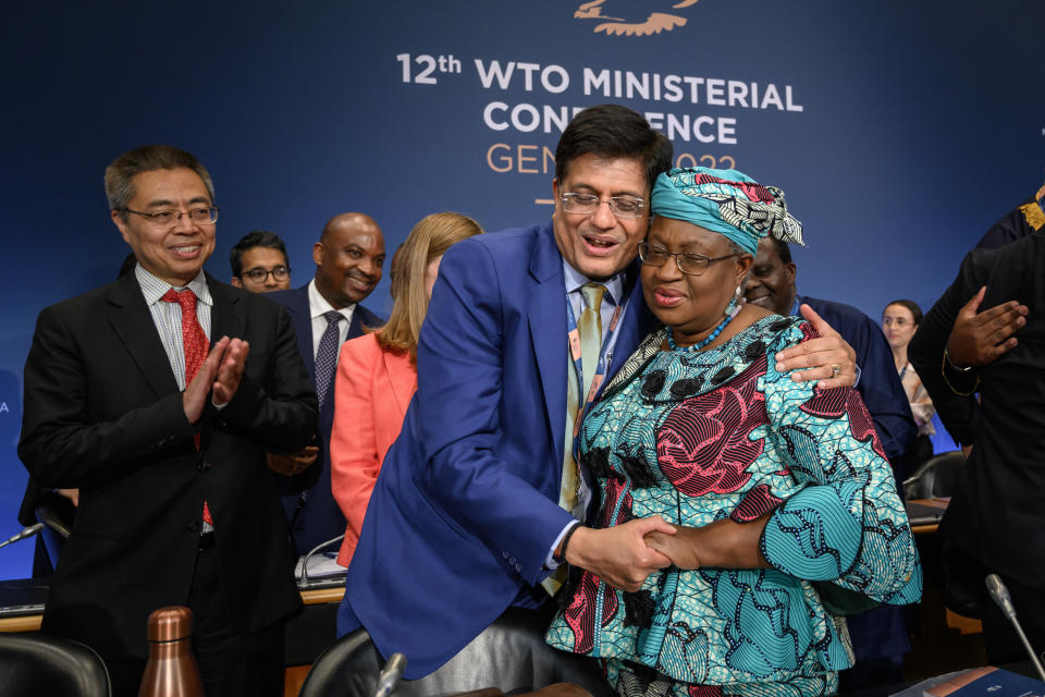 World Trade Organization Director-General Ngozi Okonjo-Iweala, right, is congratulated by Indian Minister of Commerce Piyush Goyal after a closing session of a World Trade Organization Ministerial Conference at the WTO headquarters in Geneva early Friday, June 17, 2022. (Fabrice Coffrini/Pool Photo/Keystone via AP)