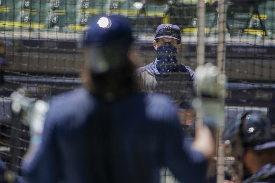 Milwaukee Brewers manager Craig Counsell watches batters during a practice session Monday, July 13, 2020, at Miller Park in Milwaukee. (AP Photo/Morry Gash)