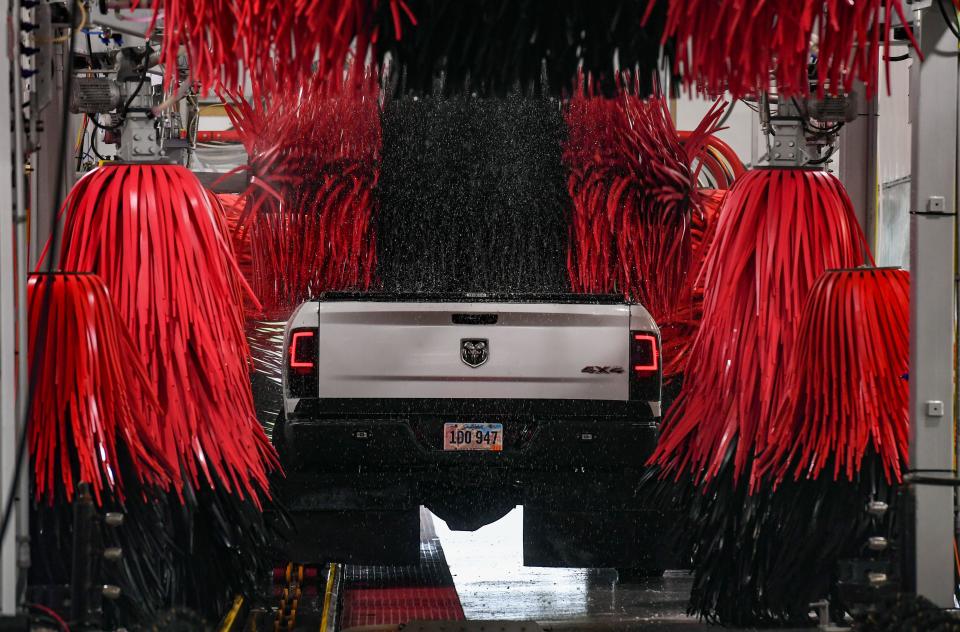 A pickup truck is scrubbed by rotating brushes and wraparounds at the Silverstar car wash on Monday, August 23, 2021 on 41st Street in Sioux Falls.