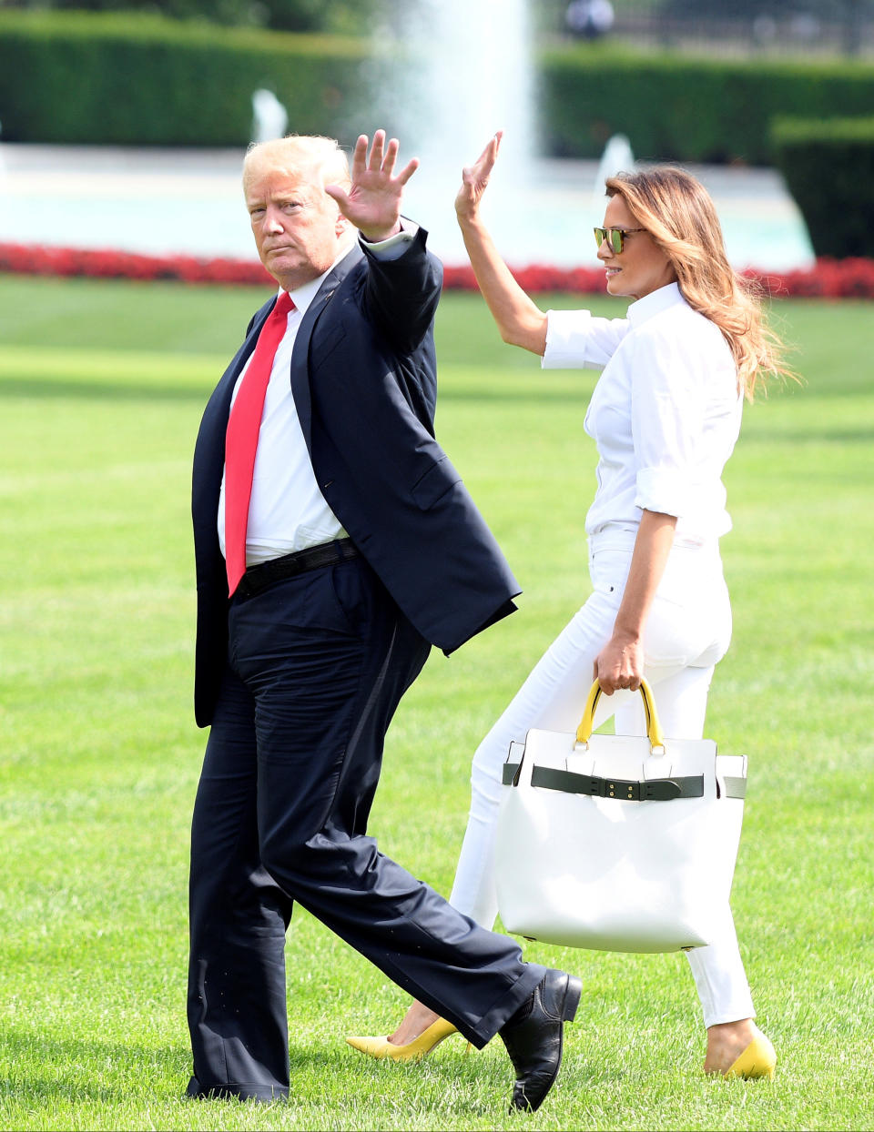 U.S. President Donald Trump and First Lady Melania Trump walk to Marine One upon departure from the White House, in Washington, U.S., July 27, 2018. REUTERS/Mary F. Calvert