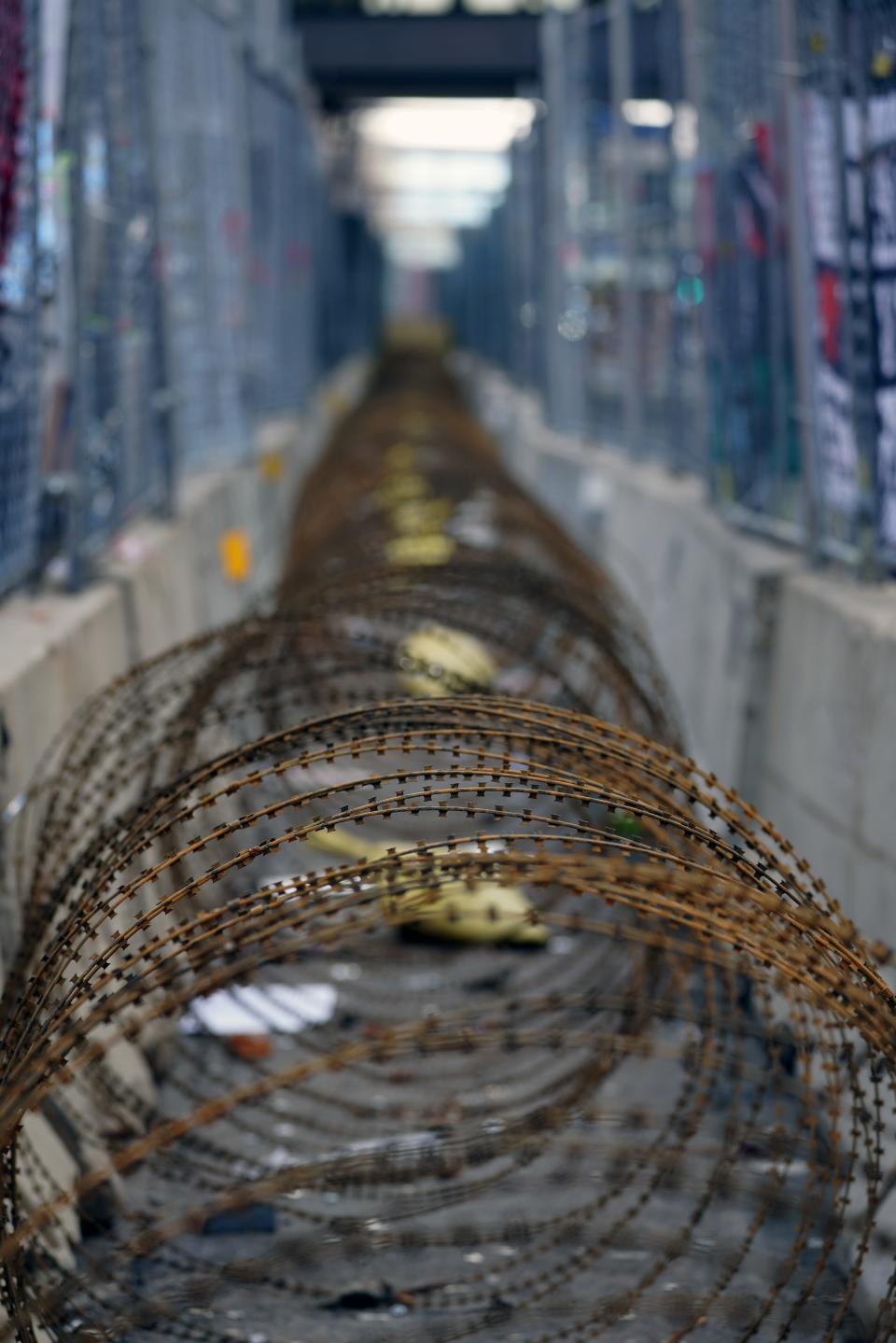 Razor wire fills the gap between two fences surrounding the fortified Hennepin County Government Center during the trial of former Minneapolis police officer Derek Chauvin, who is accused of killing George Floyd.