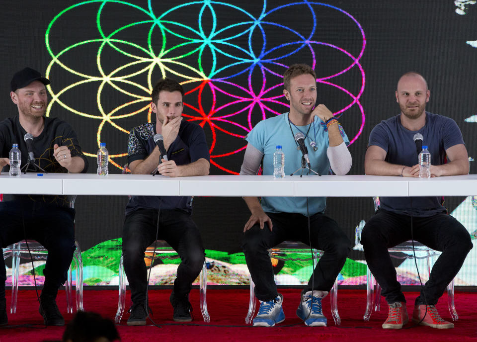 FILE - In this Friday, April 15, 2016 file photo, members of British band Coldplay, from left, Jonny Buckland, Guy Berryman, Chris Martin, and Will Champion, participate in a press conference at Foro Sol in Mexico City. The British band Coldplay has decided not to launch a global tour because of environmental concerns. Frontman Chris Martin told the BBC Thursday, Nov. 21, 2019 that the band is not going on tour to promote its latest album because it wants to take time to determine how a tour can be beneficial to the environment. (AP Photo/Rebecca Blackwell, file)