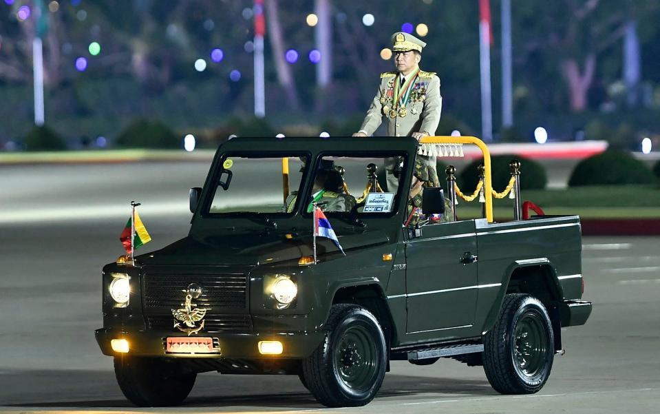 Min Aung Hlaing, the head of Myanmar's ruling military council, arrives to a ceremony to mark the country's Armed Forces Day in Naypyidaw on Wednesday