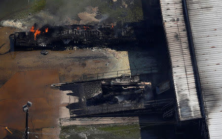 FILE PHOTO: A fire burns at the flooded plant of French chemical maker Arkema SA after Tropical Storm Harvey passed in Crosby, Texas, U.S. August 31, 2017. REUTERS/Adrees Latif