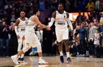 Mar 16, 2019; Denver, CO, USA; Denver Nuggets forward Paul Millsap (4) celebrates the go ahead points with guard Jamal Murray (27) in fourth quarter against the Indiana Pacers at the Pepsi Center. Mandatory Credit: Ron Chenoy-USA TODAY Sports